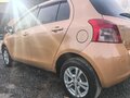 2005 Toyota Vitz II (XP90), оранжевый, 510000 рублей - вид 9