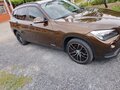 2013 BMW X1 20i I (E84) Рестайлинг, коричневый, 1360000 рублей - вид 9