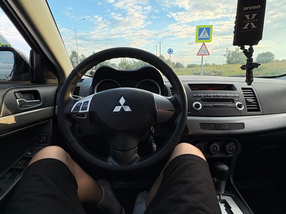 2010 Mitsubishi Lancer X, чёрный, 720000 рублей - вид 7