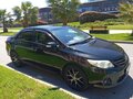 2010 Toyota Corolla X (E140, E150) Рестайлинг, чёрный, 1100000 рублей - вид 6