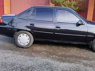 2012 Daewoo Nexia I Рестайлинг, чёрный, 220000 рублей, вид 3