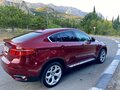 2010 BMW X6 50i 6-speed I (E71), красный - вид 1