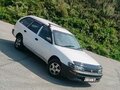 1999 Toyota Corolla VII (E100), белый, 325000 рублей