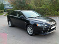 2013 Mitsubishi Lancer X Рестайлинг, чёрный, 840000 рублей - вид 1