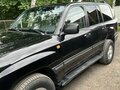 2006 Toyota Land Cruiser 100 Series Рестайлинг 2, чёрный, 1800000 рублей - вид 4
