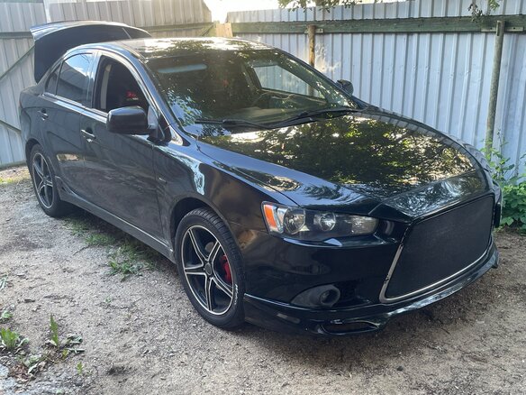 2013 Mitsubishi Lancer X Рестайлинг, чёрный, 1100000 рублей - вид 2