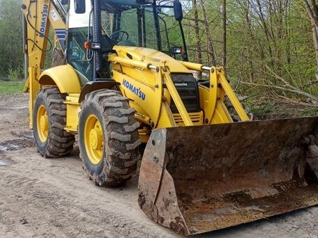 2005 Komatsu WB97S-2, жёлтый, 4400000 рублей, вид 1