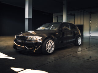 2011 BMW 1 серии 116i I (E81/E82/E87/E88) Рестайлинг, чёрный, 2700000 рублей, вид 1