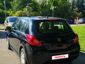 2010 Nissan Tiida I Рестайлинг, чёрный - вид 1