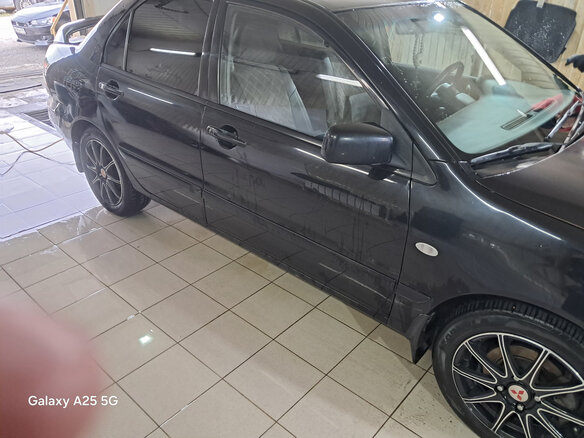 2009 Mitsubishi Lancer Classic IX Рестайлинг, чёрный - вид 2