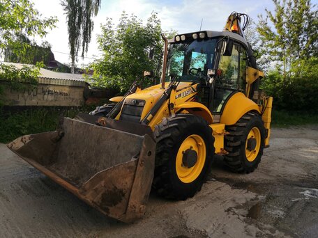 2005 New Holland B115B, жёлтый, 4500000 рублей, вид 2