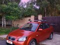 2011 Kia Rio II Рестайлинг, оранжевый, 490000 рублей