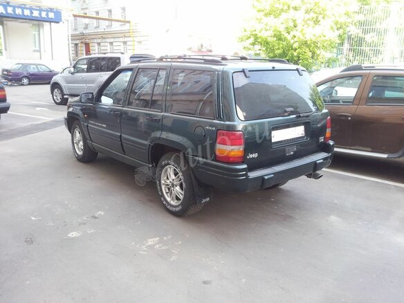 1998 Jeep Grand Cherokee I (ZJ) Рестайлинг, зелёный - вид 1