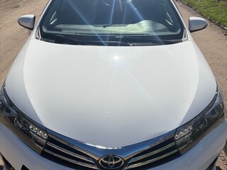 2015 Toyota Corolla XI (E160, E170, E180), белый, 1450000 рублей, вид 1