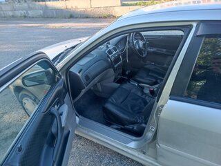 2003 Ford Laser IV, серебристый, 230000 рублей, вид 5