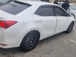 2014 Toyota Corolla XI (E160, E170, E180), белый, 1450000 рублей, вид 4
