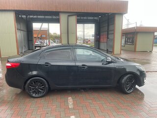2012 Kia Rio 5-speed III, чёрный, 710000 рублей, вид 3