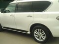 2011 Nissan Patrol VI (Y62), белый - вид 2
