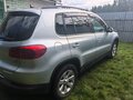 2011 Volkswagen Tiguan I Рестайлинг, серебристый, 730000 рублей - вид 4