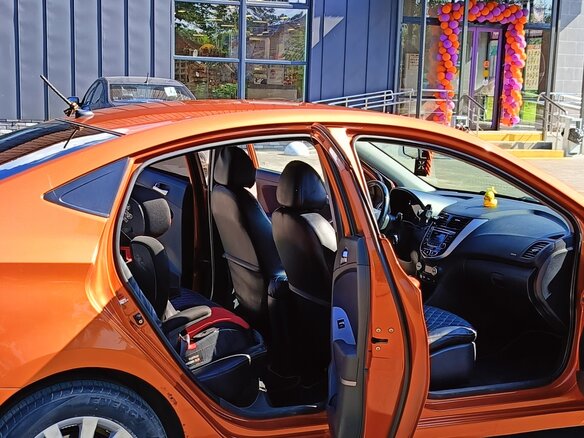 2014 Hyundai Solaris I Рестайлинг, оранжевый - вид 7
