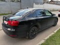 2012 Volkswagen Jetta VI, чёрный - вид 2