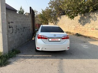 2014 Toyota Corolla XI (E160, E170, E180), белый, 920000 рублей, вид 3