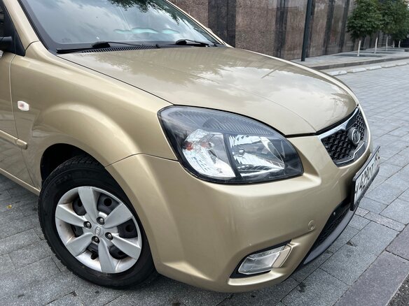 2011 Kia Rio II Рестайлинг, бежевый - вид 7