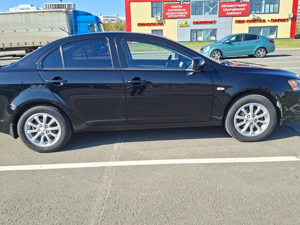 2010 Mitsubishi Lancer X, чёрный, 629000 рублей - вид 3