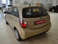 2010 Kia Rio II Рестайлинг, бежевый - вид 2