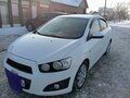 2012 Chevrolet Aveo II, белый, 630000 рублей