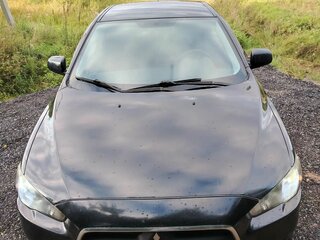 2011 Mitsubishi Lancer X Рестайлинг, чёрный, 750000 рублей, вид 2