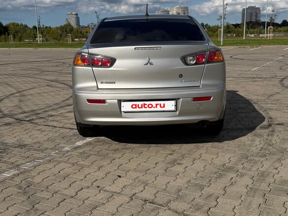 2012 Mitsubishi Lancer X Рестайлинг, серебристый, 850000 рублей - вид 4