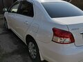 2010 Toyota Belta I, белый, 825000 рублей - вид 8