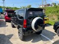 2010 Suzuki Jimny Kei car III Рестайлинг 1, чёрный - вид 2