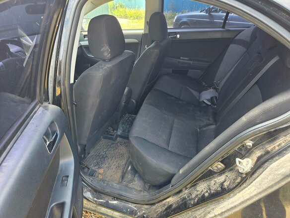 2010 Mitsubishi Lancer X, чёрный, 414000 рублей - вид 16