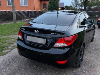 2011 Hyundai Solaris I, чёрный, 850000 рублей, вид 2