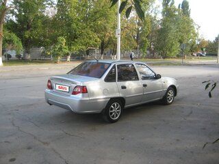 2011 Daewoo Nexia I Рестайлинг, серебристый, 210000 рублей, вид 3