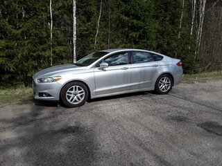 2015 Ford Fusion (North America) II, серебристый, 1200000 рублей, вид 2