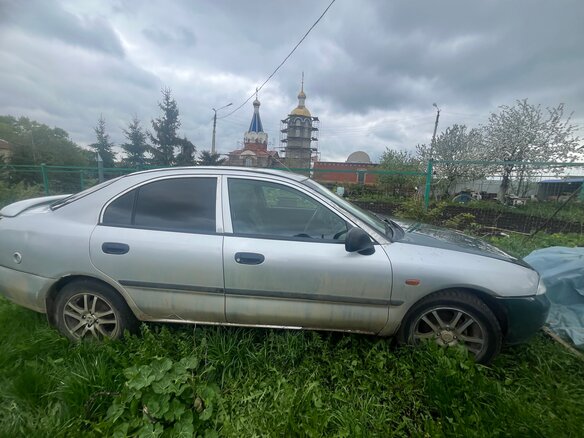 1998 Mitsubishi Carisma I, серый, 125000 рублей - вид 2