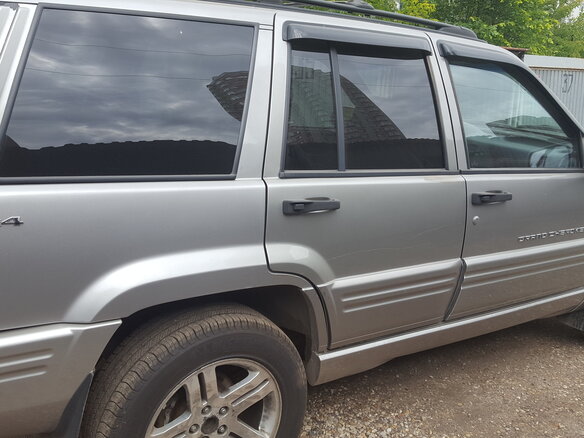 1997 Jeep Grand Cherokee I (ZJ) Рестайлинг, серебристый - вид 4