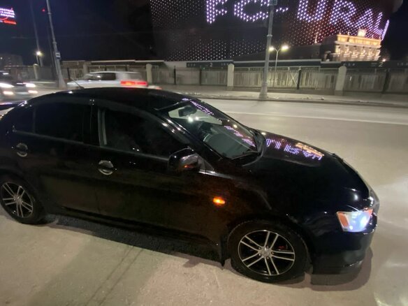 2011 Mitsubishi Lancer X Рестайлинг, чёрный, 870000 рублей - вид 2