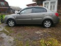 2010 Kia Rio II Рестайлинг, серебристый - вид 3