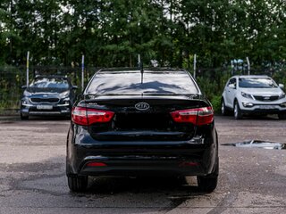 2012 Kia Rio 5-speed III, чёрный, 660000 рублей, вид 4