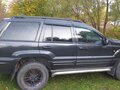 1999 Jeep Grand Cherokee II (WJ), чёрный - вид 1