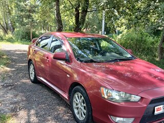 2010 Mitsubishi Lancer X, красный, 615000 рублей, вид 1