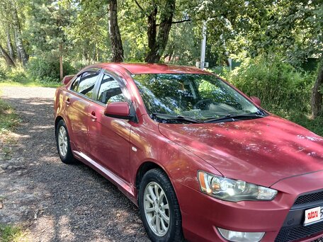 2010 Mitsubishi Lancer X, красный, 615000 рублей, вид 1