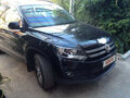 2012 Volkswagen Tiguan I Рестайлинг, чёрный - вид 1