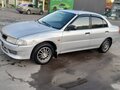 1999 Mitsubishi Lancer VII, серебристый, 280000 рублей - вид 1