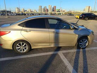 2011 Hyundai Solaris I, золотистый, 650000 рублей, вид 2