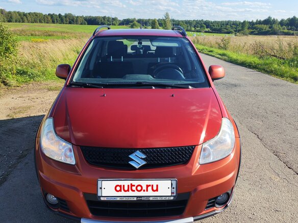 2010 Suzuki SX4 I (Classic) Рестайлинг, оранжевый - вид 1